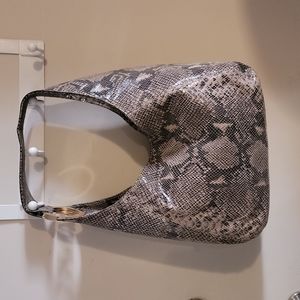 Michael Kors bag with gold MK logo in strap